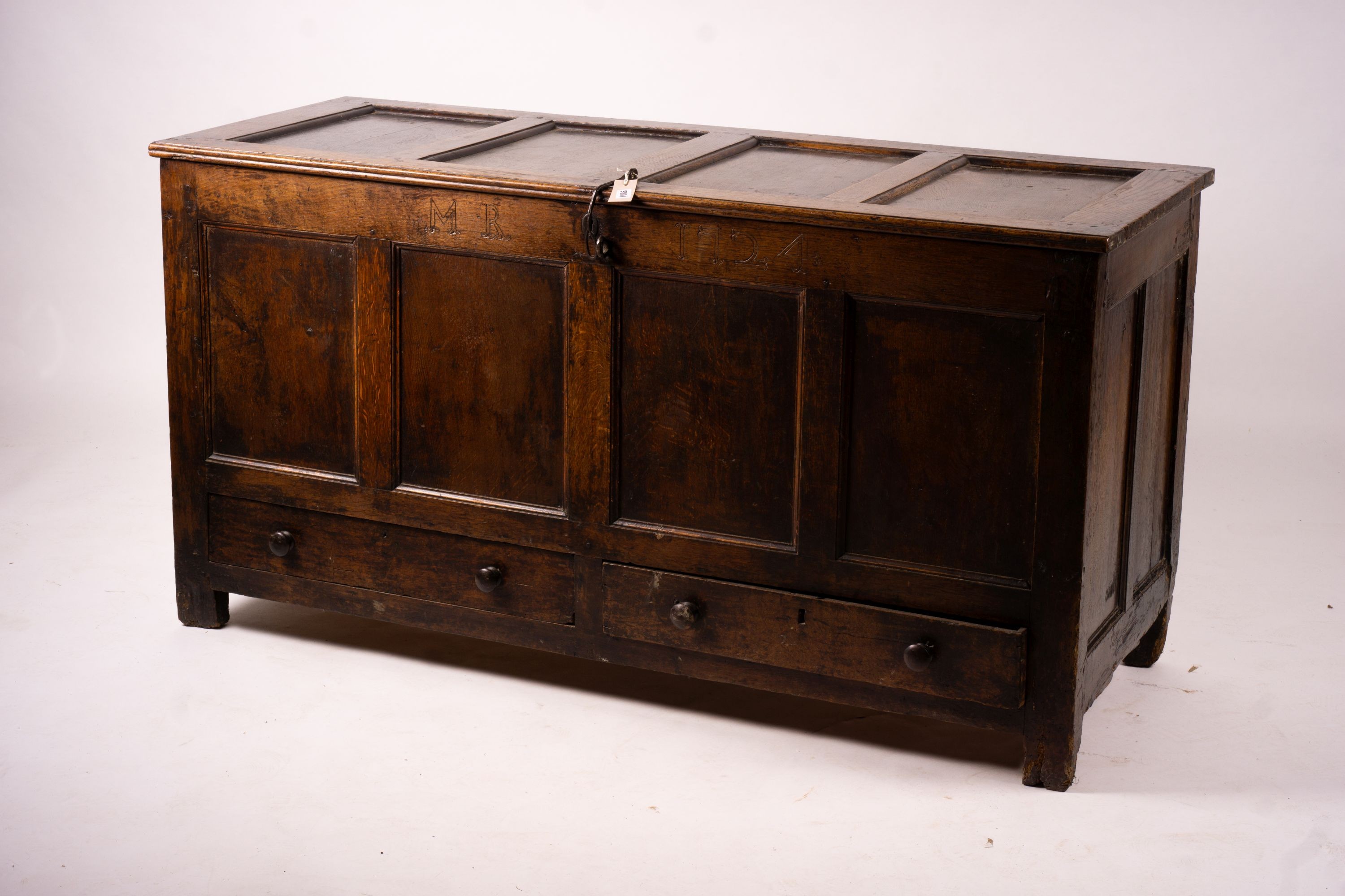 An 18th century panelled oak mule chest, length 161cm, depth 61cm, height 84cm